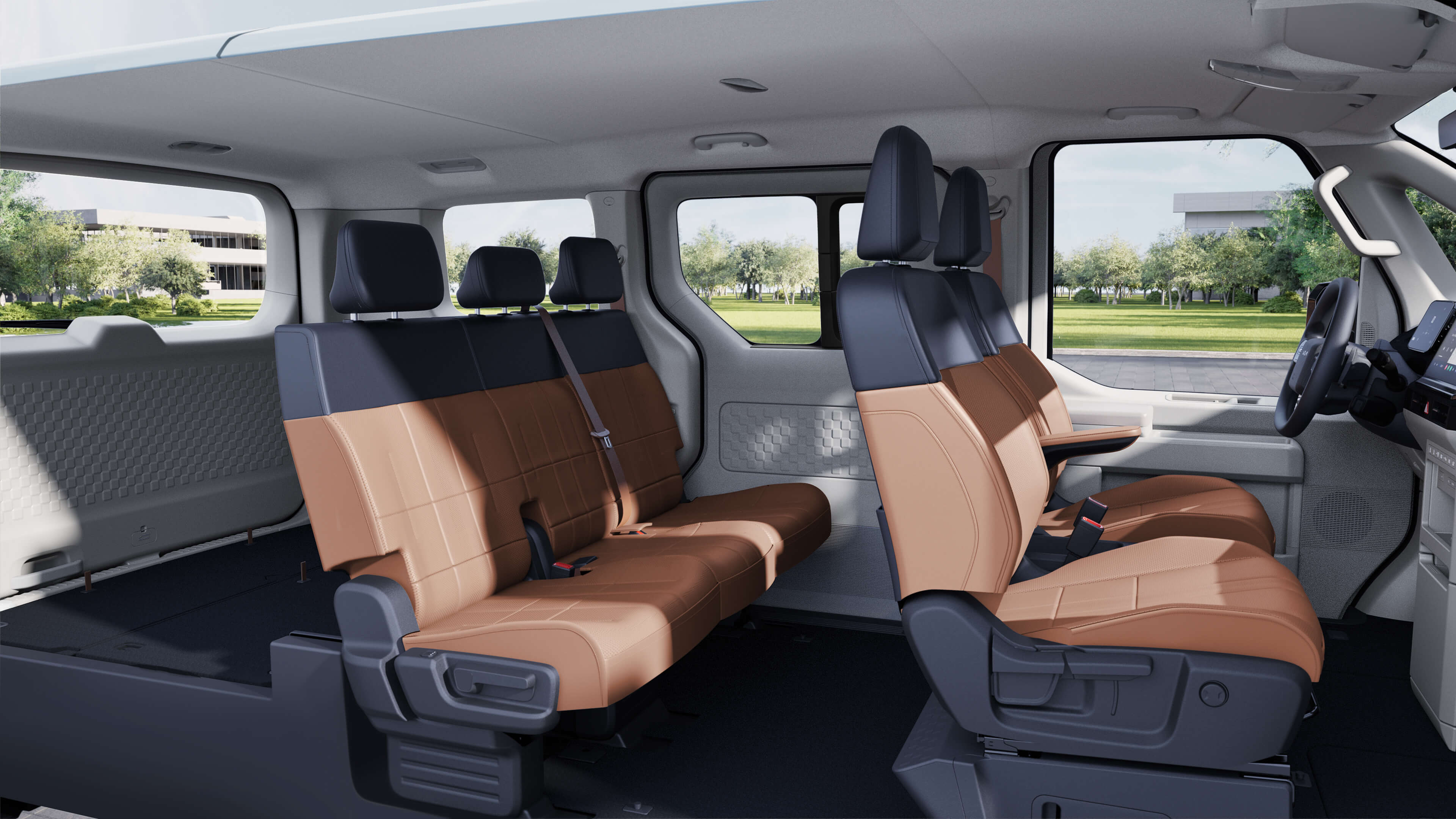 Vue latérale intérieure du Kia PV5 Passenger avec configuration flexible des sièges.