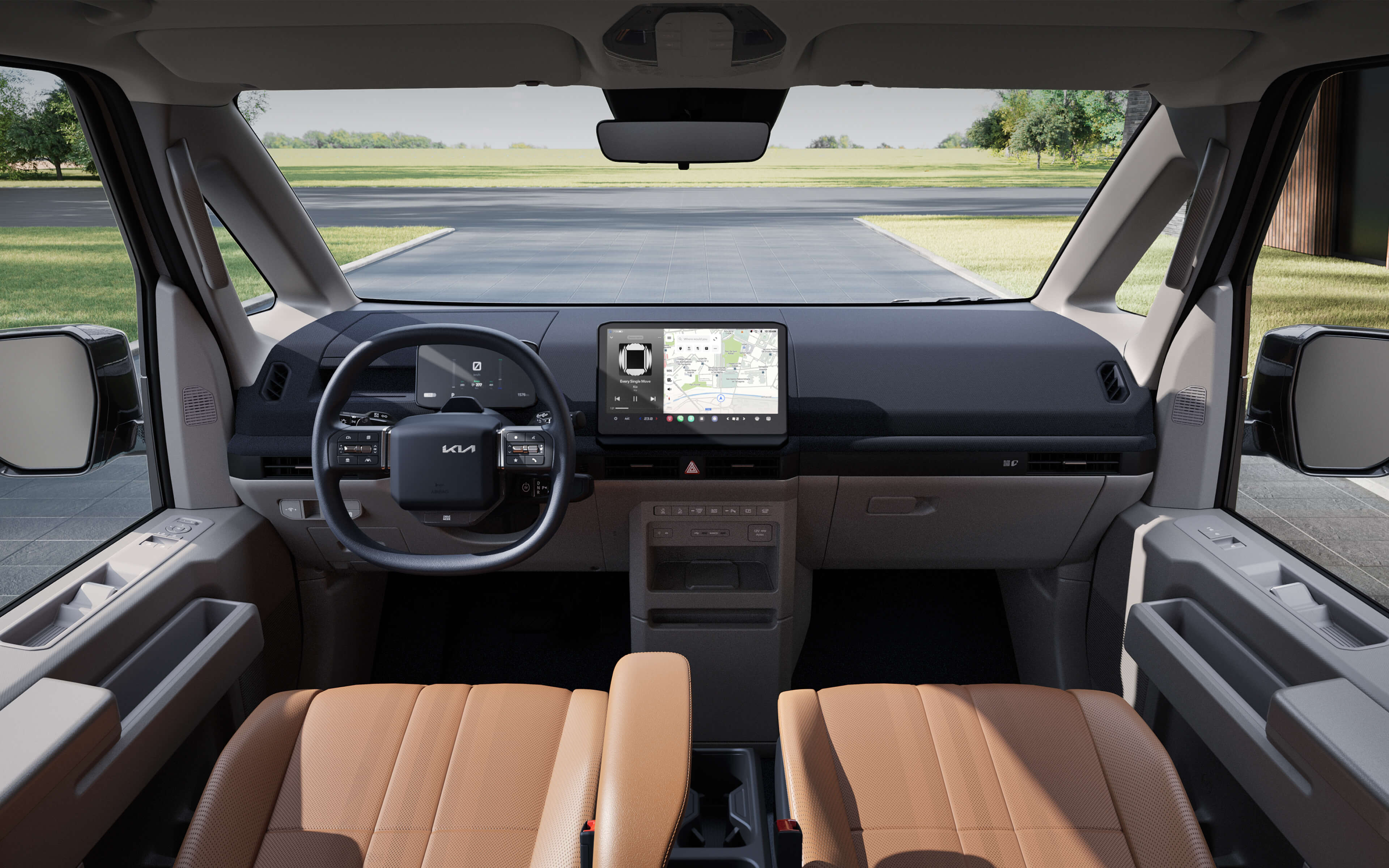 Vue intérieure avant du Kia PV5 Passenger mettant en évidence la grande visibilité offerte par le pare-brise, le volant chauffant et les matériaux durables des sièges pour un usage quotidien.