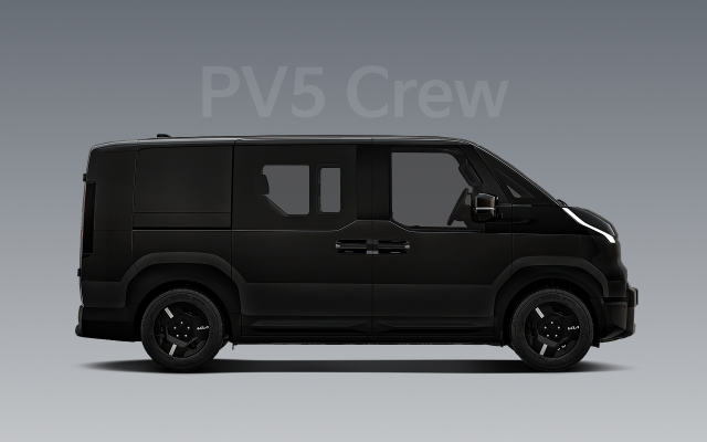 Side view of the black Kia PV5 Crew with tinted windows