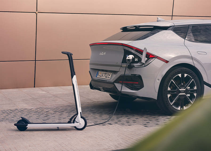 A Kia Electric car using Vehicle-to-Load to charge an electric bike