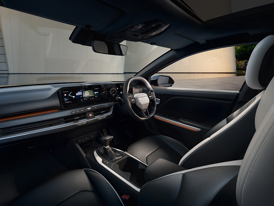 Interior of the Kia EV2 Concept cabin, steering wheel, dashboard and front-row seats